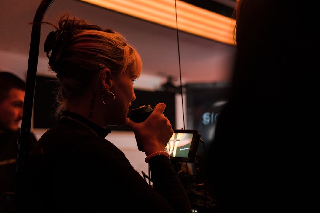 Event crew member communicating on a two-way radio near a stage